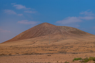 Fototapeta na wymiar Deserted Mountains close to Betancuria in the inner part of Fuerteventura Island, Spain.