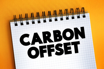 Carbon Offset text on notepad, concept background.