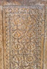 Wooden carved antique door as background ancient vintage pattern of Asian peoples, ancient east Kazakhstan Uzbekistan