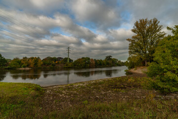 Fototapeta na wymiar River Labe near central Bohemian town Kolin in autumn color morning