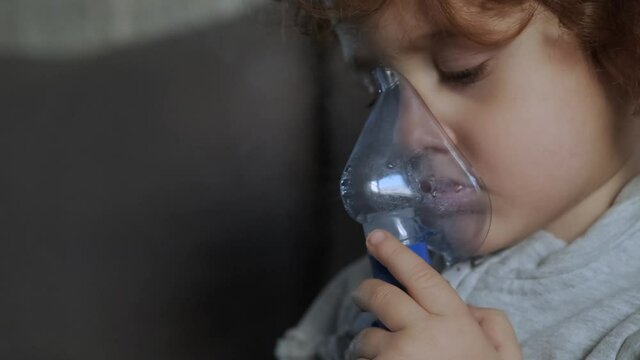 Little girl with Influenza who independently aerosols