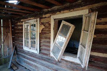 Old wooden abandoned house with broken windows