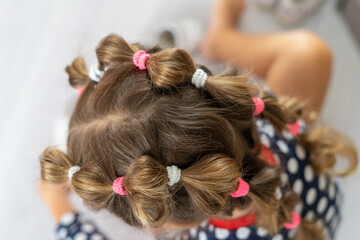 Fototapeta premium A beautiful hairstyle on the girl's head.