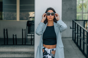 girl with sunglasses on the city street