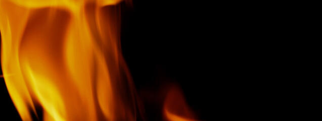 Fototapeta premium Fire background. Abstract burning flame and black background. represents the power of burning refers to heat spicy seductive sensual or burning fuels. fire incidents burning destroys everything.