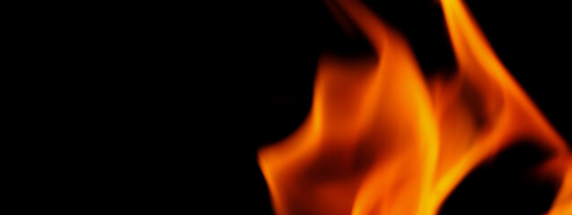 Fototapeta premium Fire background. Abstract burning flame and black background. represents the power of burning refers to heat spicy seductive sensual or burning fuels. fire incidents burning destroys everything.