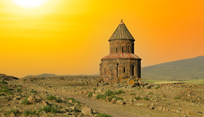 Ani Ancient historical church building at sunset. St. Gregory Church in Ani Ruins. Kars,Turkey - obrazy, fototapety, plakaty