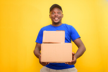 An African delivery or dispatch man carrying boxes