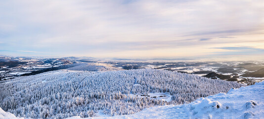 beautiful winter view of the valley from Ještěd and sunset