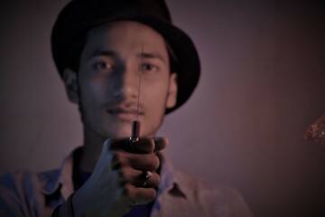young man with toy knife at indoor