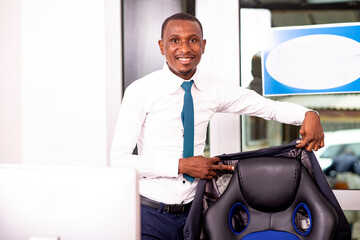 young businessman smiling in an office.