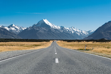 Road to Mt Cook, the highest mountain in New Zealand. Scenic highway drive along Lake Pukaki in Aoraki Mt Cook National Park, South Island of New Zealand.