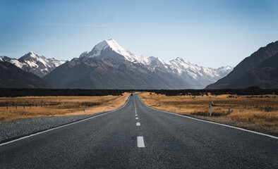 Road to Mt Cook, the highest mountain in New Zealand. Scenic highway drive along Lake Pukaki in...