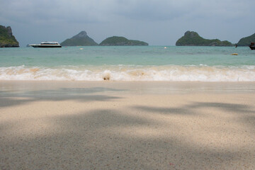 Fototapeta na wymiar Thailand islands sea shore beach rocks white coral sand blue sky