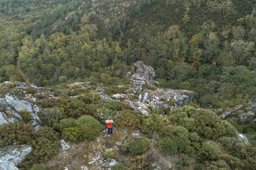 Aerial view of hiker man  on top of a mountain