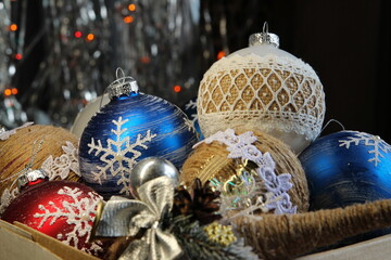 Box with Christmas balls toys. New Year mood preparation for New Year and Christmas