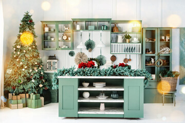 Interior of green kitchen with christmas decor, tree and christmas lights