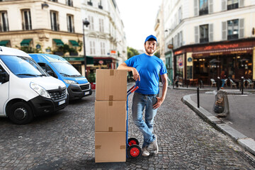 Man with blue uniform in front of the shops for delivery and pickup of the goods © alphaspirit