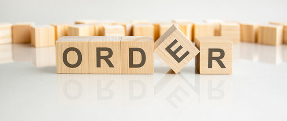 order text on a wooden blocks, gray background