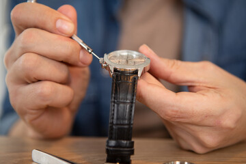 watchmaker repairing an old pocket watch