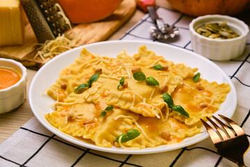 Homemade Pumpkin Ravioli with ricotta cheese served basil