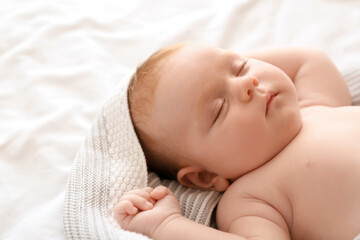 Little baby sleeping on bed