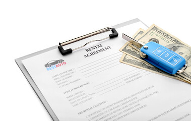 Clipboard with rental agreement, money and car key on white background, closeup