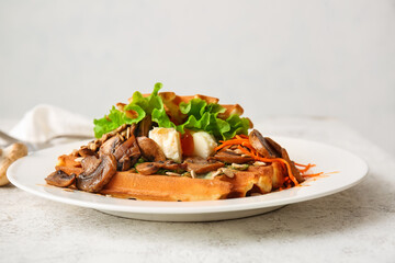 Tasty Belgian waffles with vegetables on table, closeup