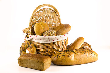 Basket with bread and whole wheat bread on white background