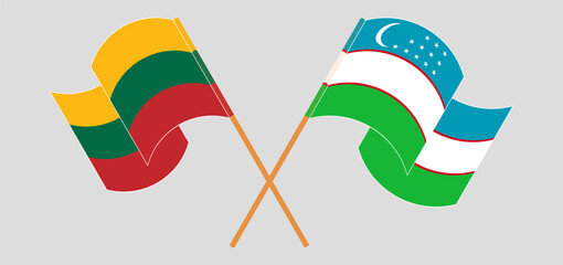 Crossed and waving flags of Lithuania and Uzbekistan