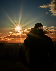 silhouette of a person in a sunset