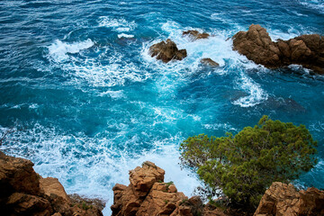 waves crashing on rocks