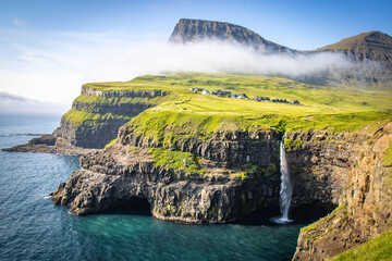 beautiful waterfall of gasadalur, faroe islands, vagar, cliffs