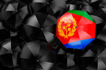 Umbrella with Eritrean flag among black umbrellas, 3D rendering