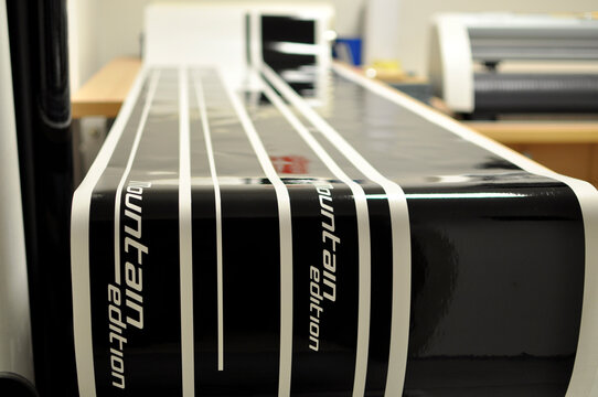 Production of stickers on a cutting plotter intended for a vehicle from black foil