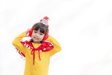 Asian little girl in red santa hat on white background.
