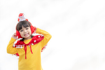 Asian little girl in red santa hat on white background.