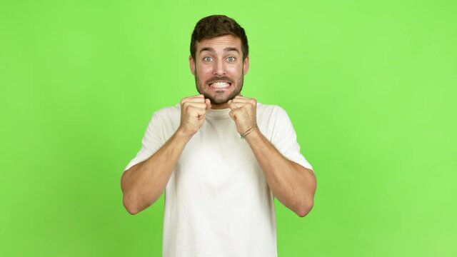 Handsome man with surprise and shocked facial expression over isolated background