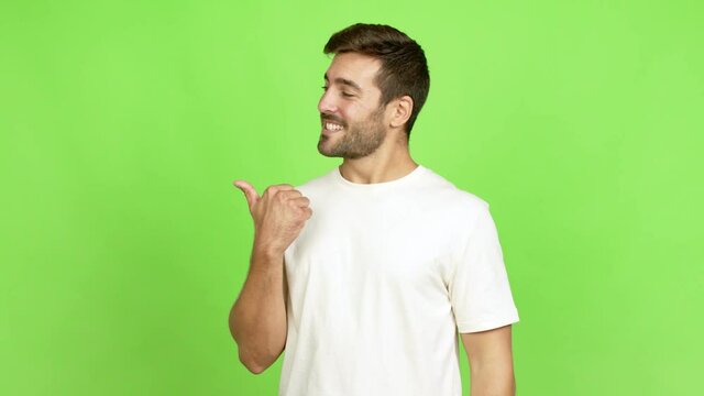 Handsome man presenting something over isolated background