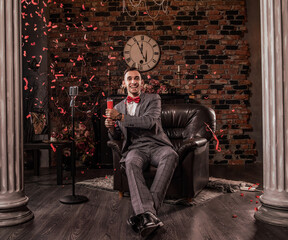 man in formal suit with flapper confetti