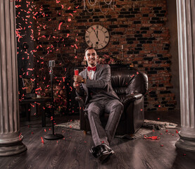 man in formal suit with flapper confetti