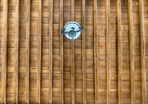 The ceiling of a joglo house, a traditional Javanese house, Indonesia, made of high grade teak wood and handmade carvings