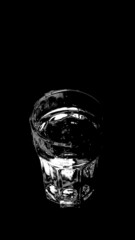 Water Splashing a Glass on a Black Background