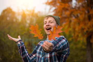 Portrait of happy young man. Autumn man. Smile male. Background. Life. Celebration. 