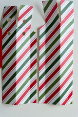 two pieces of candy cane striped cardboard 