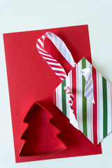 striped cardboard with ribbon and cookie cutter