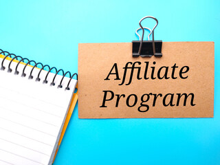 Notebooks and brown card written with text Affiliate Programs