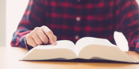 Man praying on holy bible.Read bible.Worship Faith and Read Bible Online at home.Bible study in home church, wisdom of GOD, Holy spirituality , Worship and Christian.Prayer pray.Education.