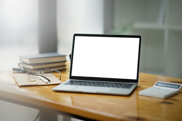Laptop on an office desk with a screen mockup Business people employee freelance online marketing e-commerce telemarketing concept.