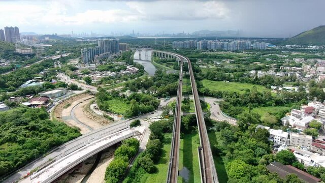 Hong Kong MTR Railroad in the city outskirts, Aerial view.